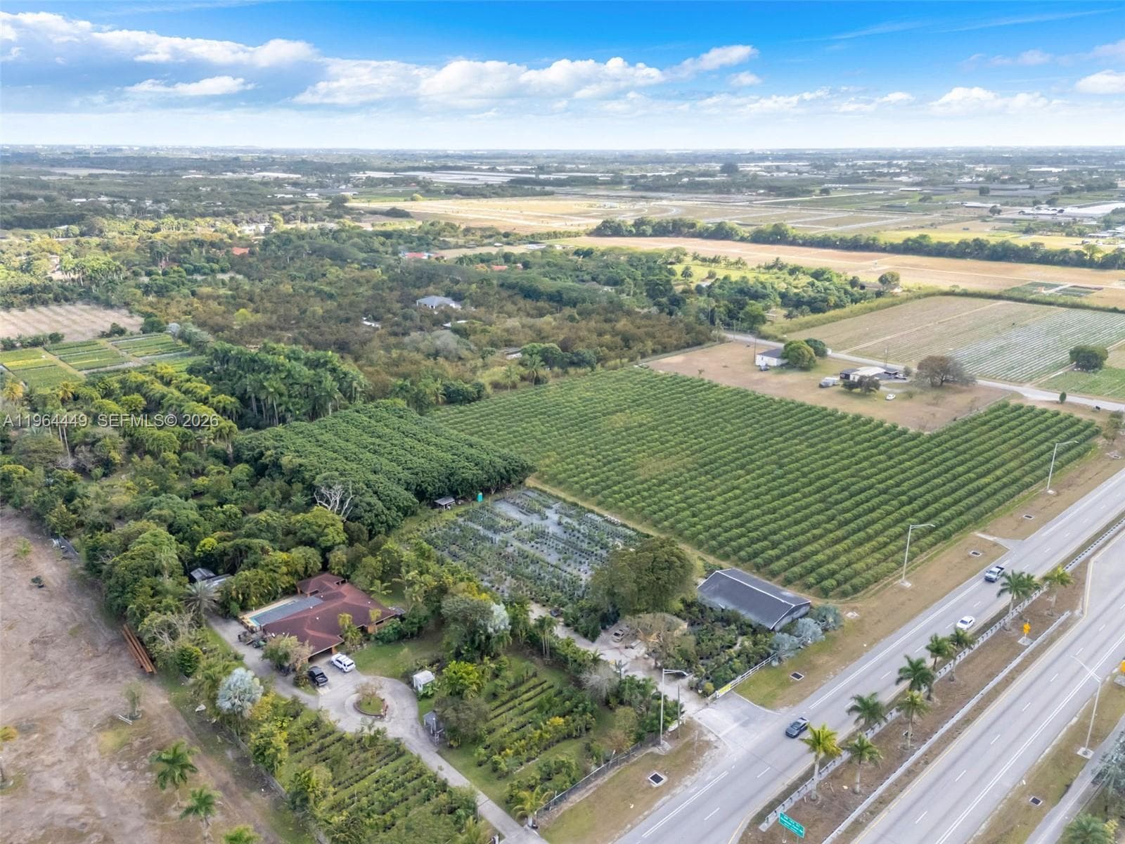 2.08 ACRES OPEN LAND UP FRONT IS CLEAR WITH A LONGAN GROVE IN REAR...SHADEHOUSE/IRRIGATION