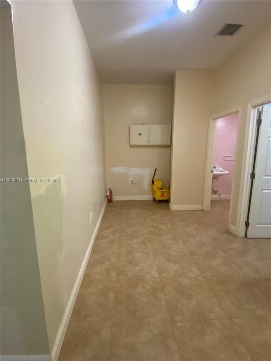 Area behind the big open space & hallway to offices