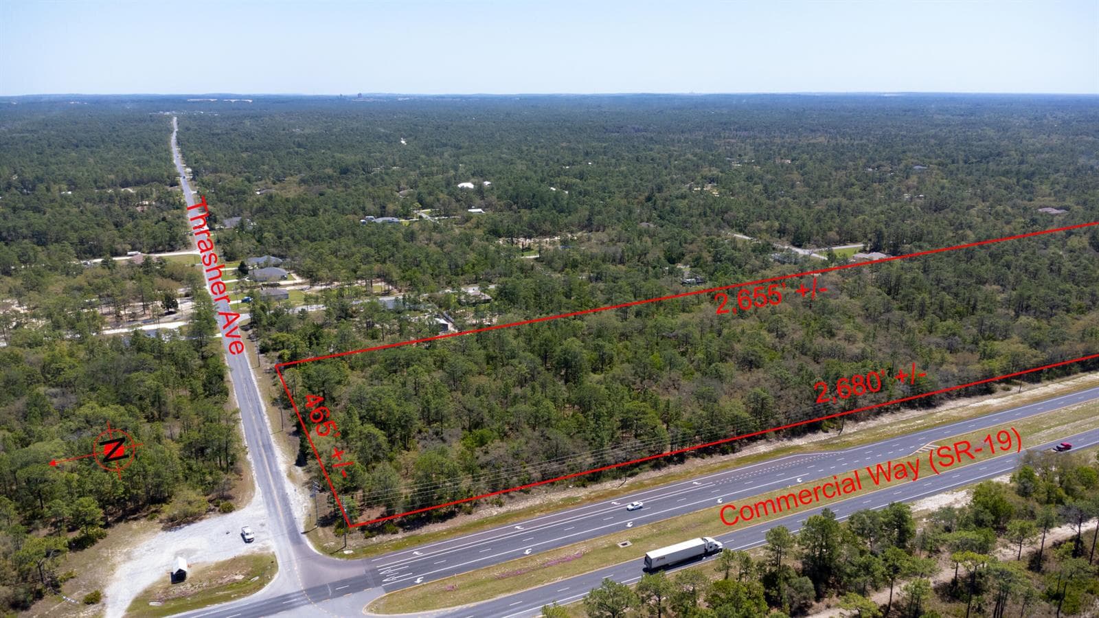 Red_sign_31_acres_lot_Thrasher_Ave_Weeki